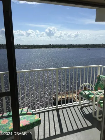 a view of balcony with furniture