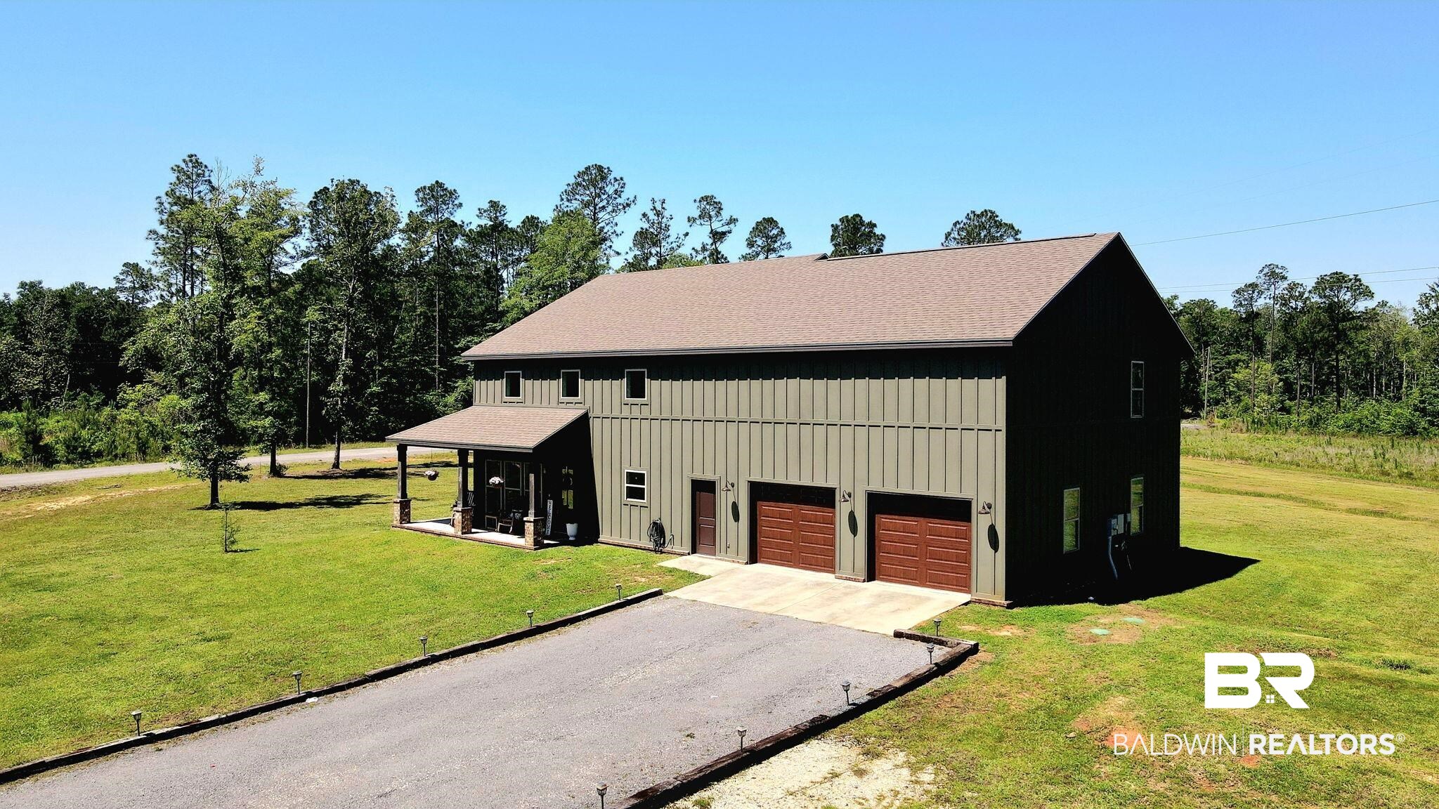 11025 Creax Road Axis, AL 36505 - Photo 39 of 45 Two-story structure featuring a covered front porch with dark support columns
