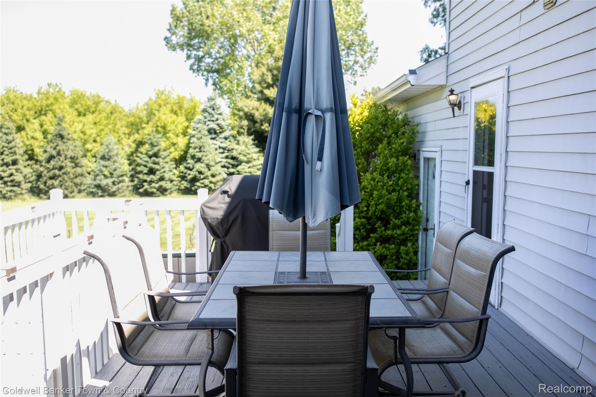 717 North Youngs Road Attica, MI 48412 - Photo 54 of 87 Expansive outdoor deck featuring wood flooring and white railing, ideal for outdoor gatherings