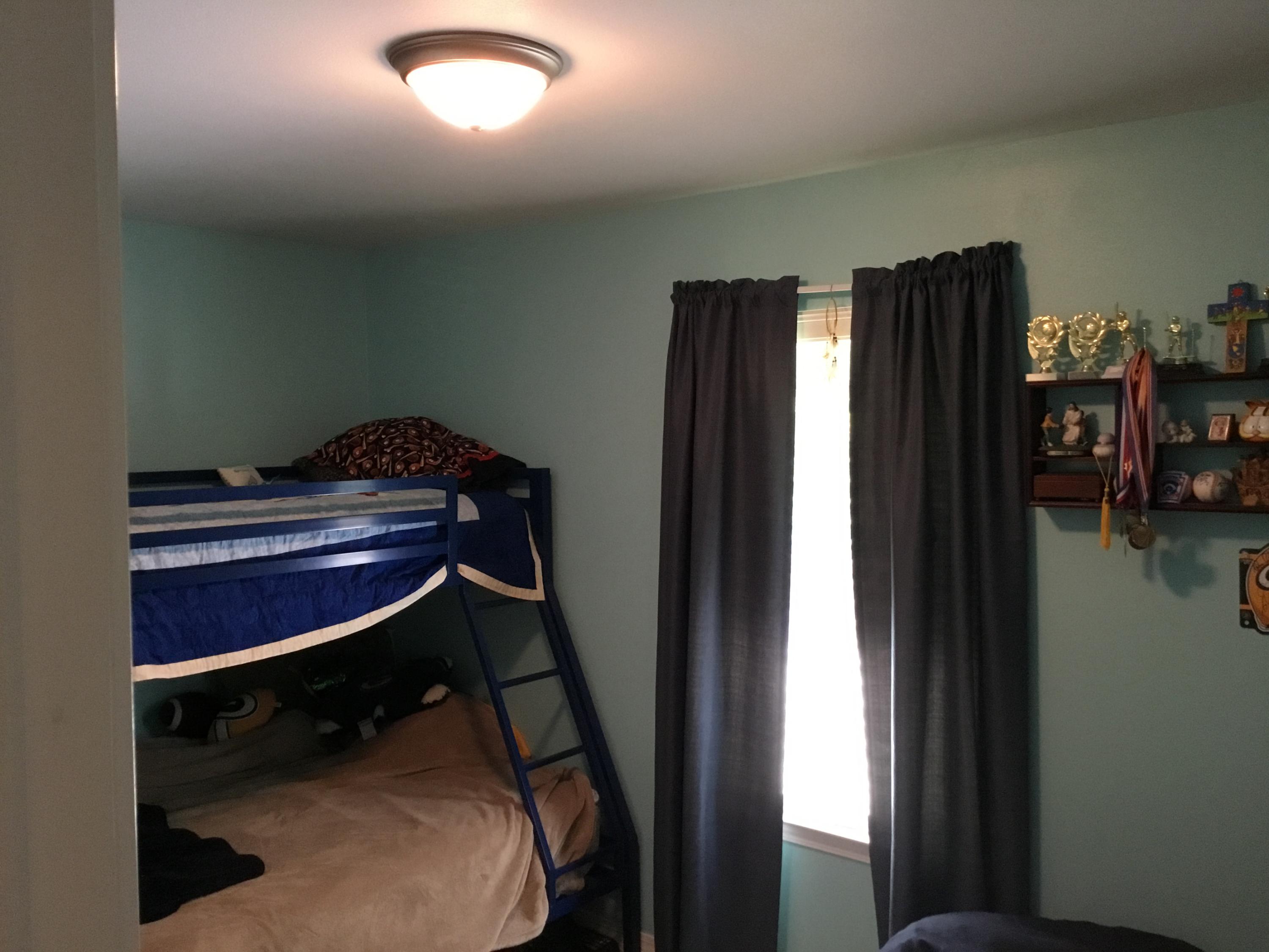 5841 Dairy Road Baker, FL 32531 - Photo 30 of 37 a room with a desk chair and piano