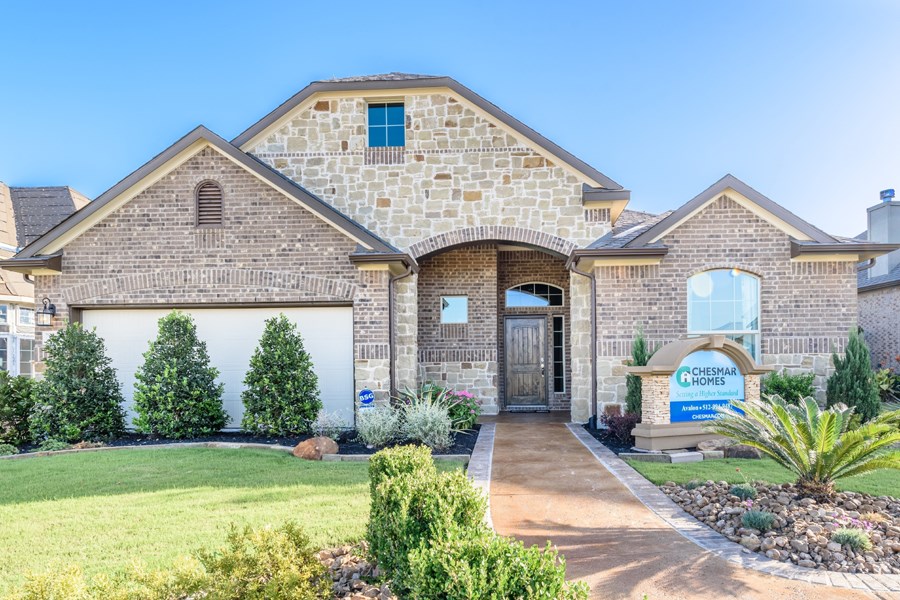 3713 Gildas Path Pflugerville, TX 78660 - Photo 1 of 1 a front view of a house with garden