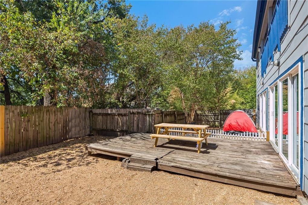 3106 Cedar Street Austin, TX 78705 - Photo 5 of 19 Wooden deck with a fenced backyard