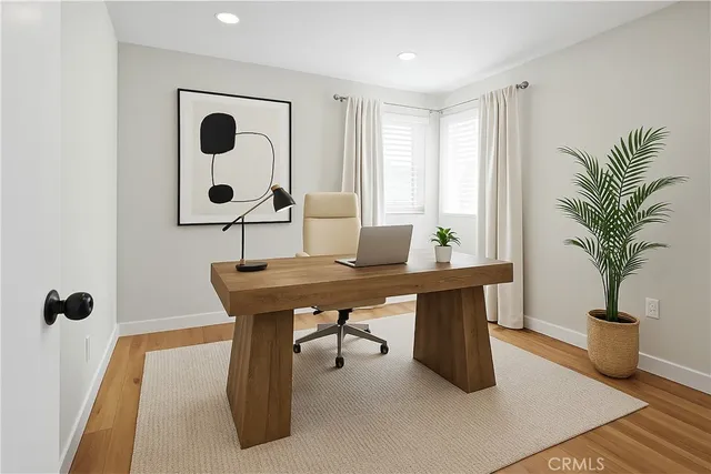 a view of a room with a table and chairs