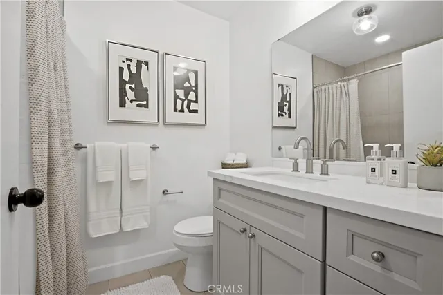 a bathroom with a toilet sink and shower