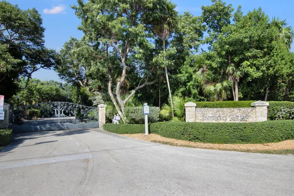 a view of a house with a tree in front of it