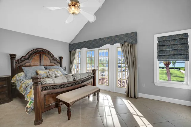 a living room with furniture a window and a chandelier