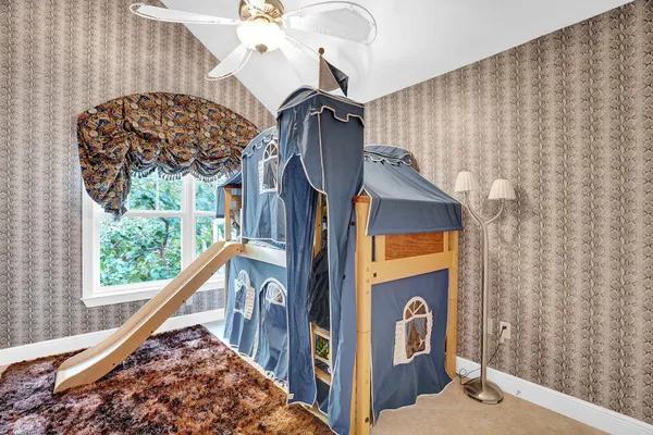 a view of staircase with a rug