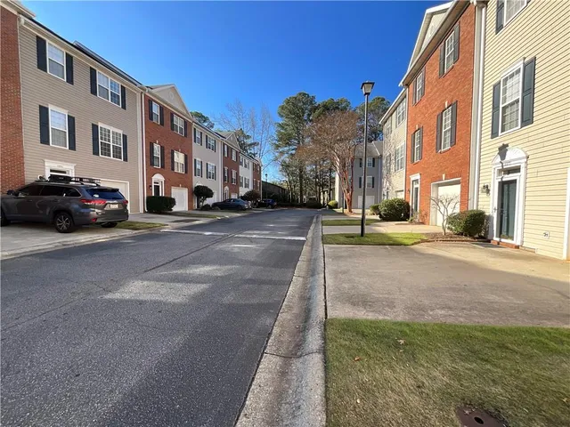 a view of a street with a building in the background