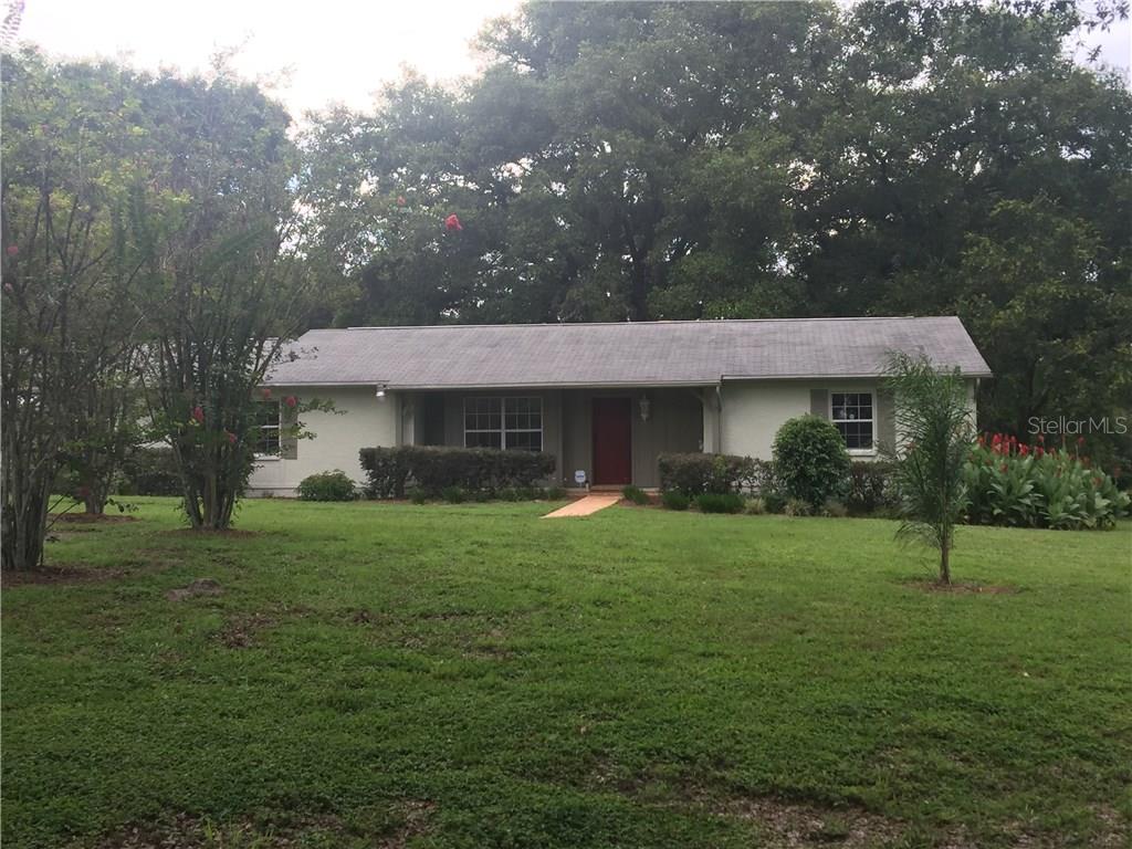 12245 Smith Road Dade City, FL 33525 - Photo 1 of 1 Beautiful one story home with extra's that equal more SF than the main home