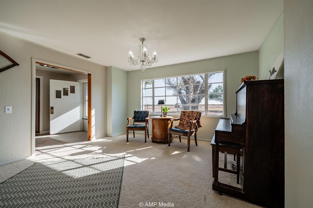 4538 463rd Rule, TX 79548 - Photo 9 of 39 a living room with furniture a dining table and a refrigerator