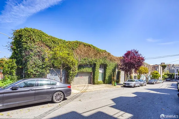 a view of a car parked in front of a house