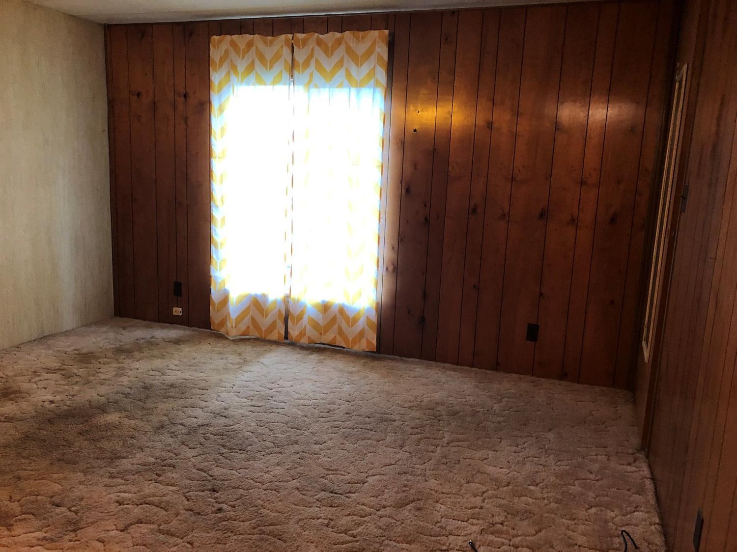 6226 East Evans Creek Road, Unit 15 Rogue River, OR 97537 - Photo 22 of 30 an empty room with windows and closet