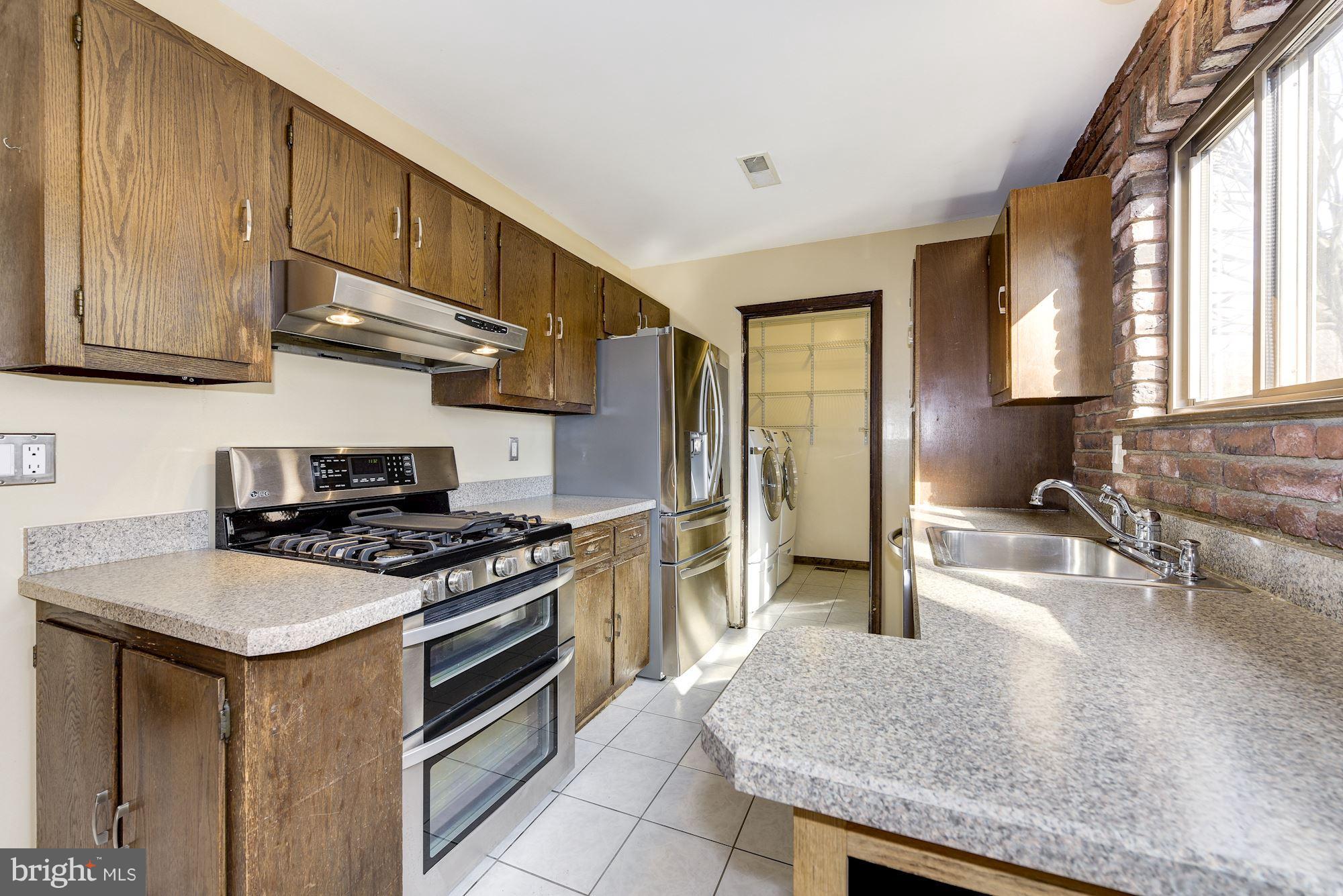 2418 Hopewell Road Marlton, NJ 08053 - Photo 11 of 42 a kitchen with stainless steel appliances granite countertop a stove a sink and a granite counter tops