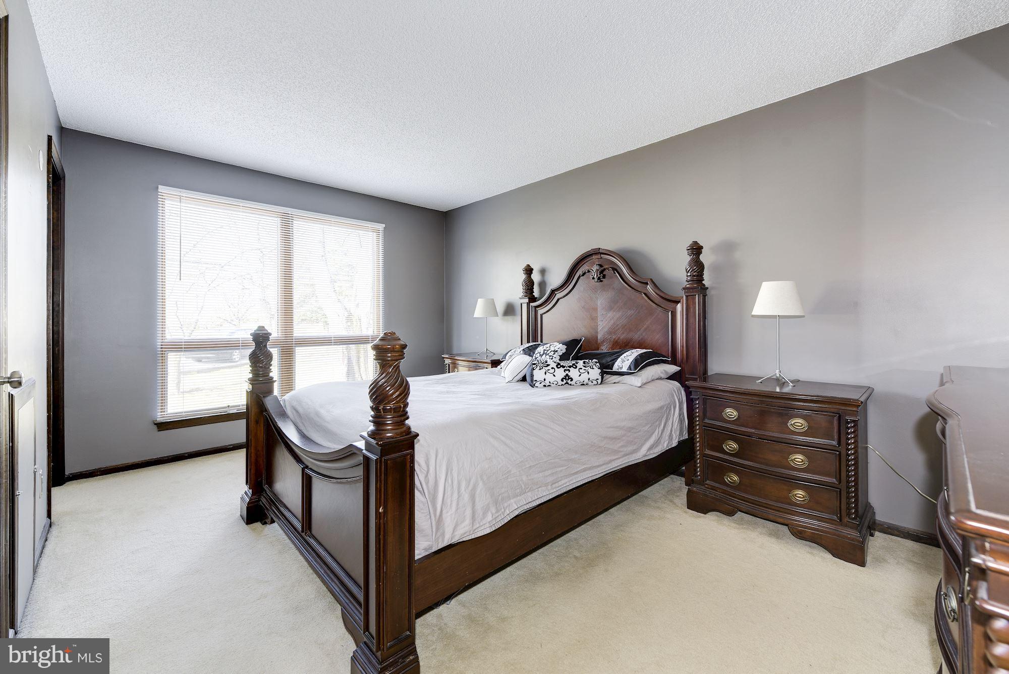 2418 Hopewell Road Marlton, NJ 08053 - Photo 19 of 42 a bed room with a bed and a chair
