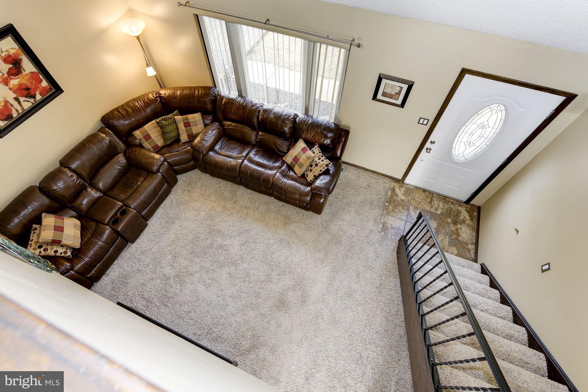 2418 Hopewell Road Marlton, NJ 08053 - Photo 27 of 42 a living room with furniture and a painting on the wall