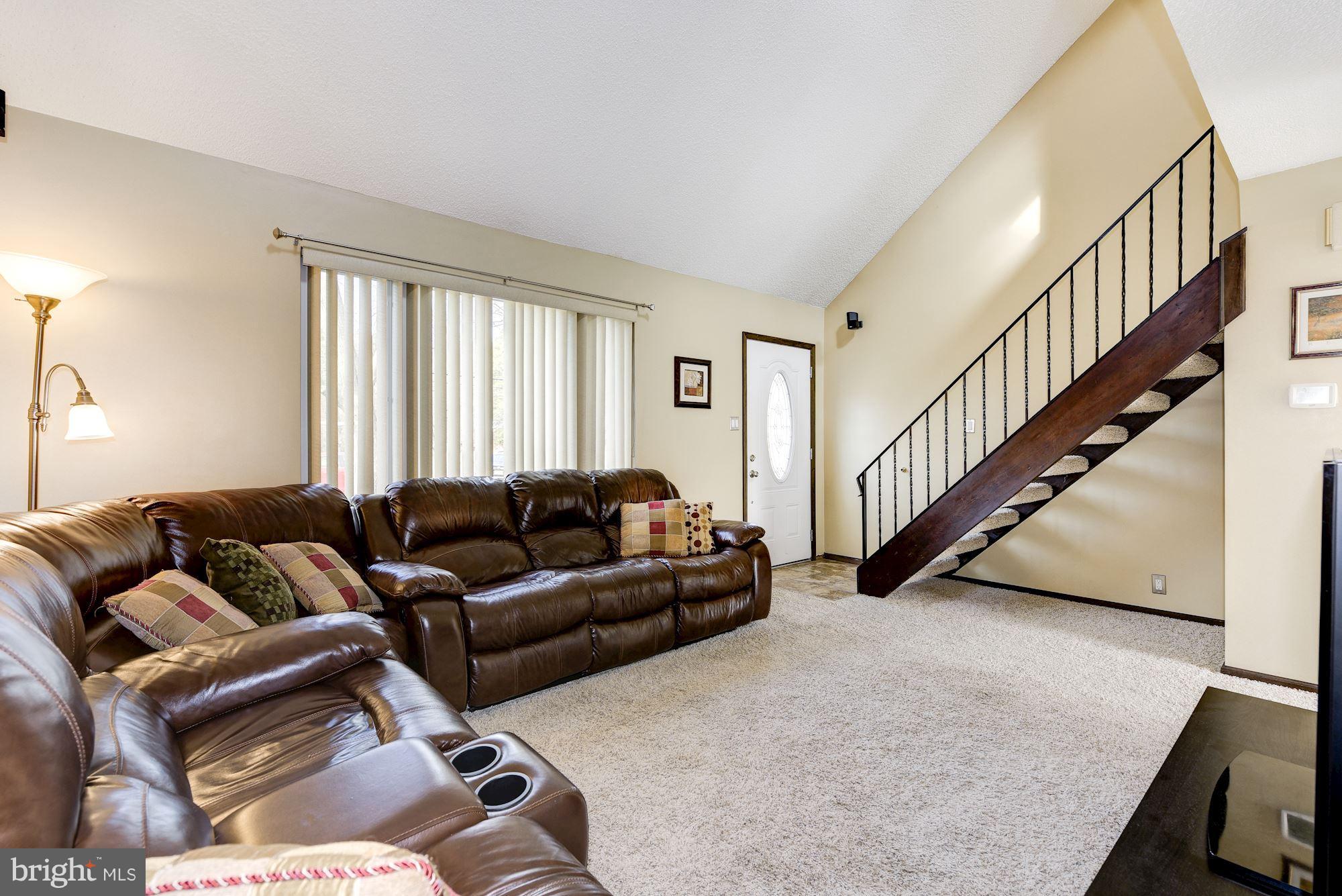 2418 Hopewell Road Marlton, NJ 08053 - Photo 7 of 42 a living room with furniture and stairs