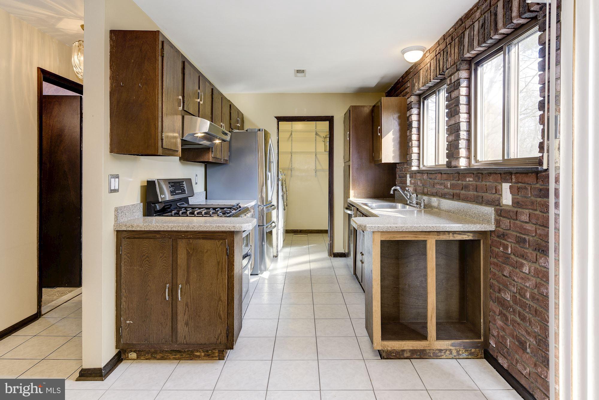 2418 Hopewell Road Marlton, NJ 08053 - Photo 8 of 42 a kitchen with stainless steel appliances granite countertop a door and a refrigerator