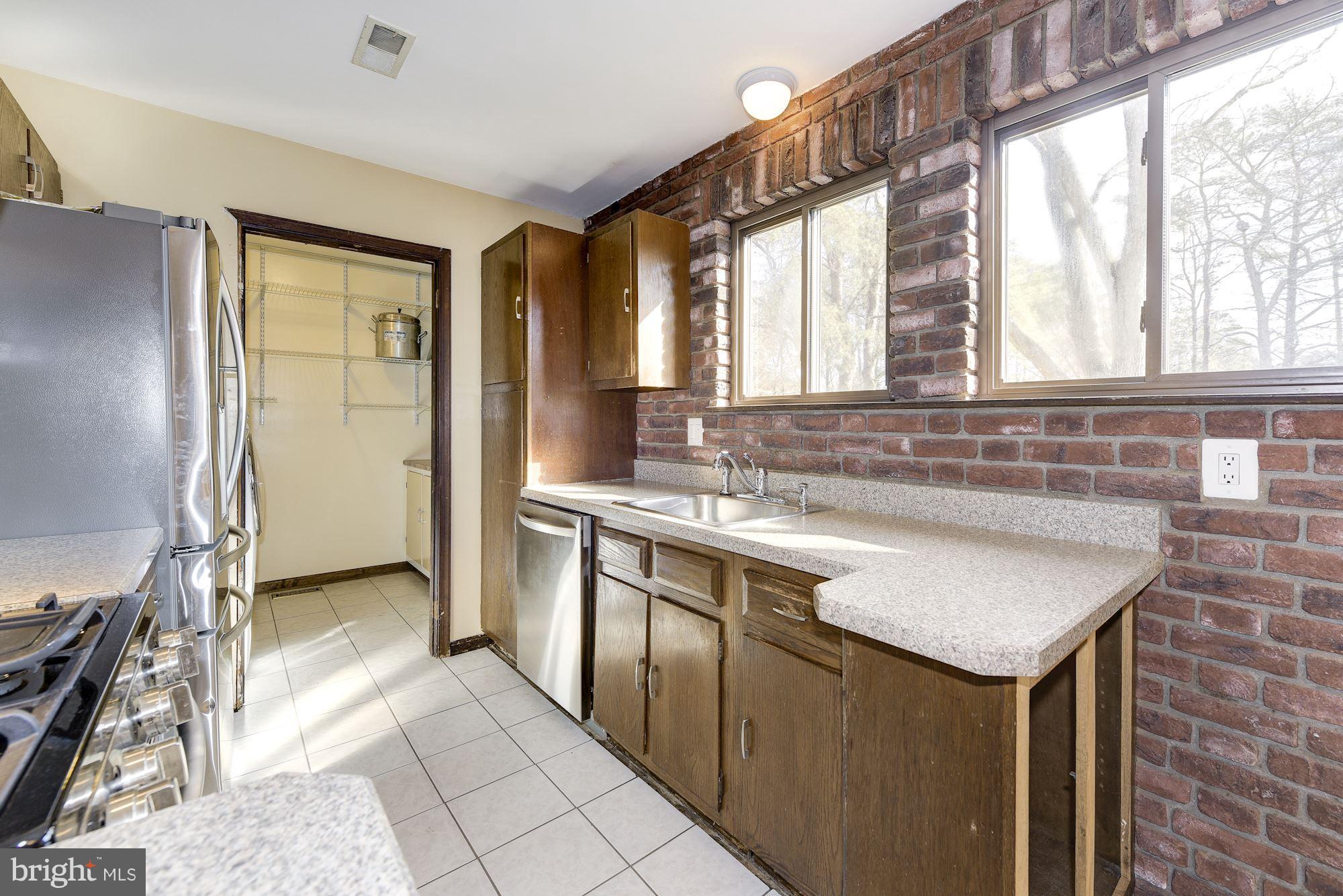 2418 Hopewell Road Marlton, NJ 08053 - Photo 10 of 42 a kitchen with stainless steel appliances granite countertop a sink and a refrigerator