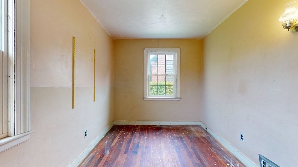 314 Burncoat Street Worcester, MA 01606 - Photo 17 of 29 a view of a room with wooden floor and windows