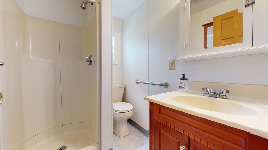 314 Burncoat Street Worcester, MA 01606 - Photo 18 of 29 a bathroom with a sink and a mirror