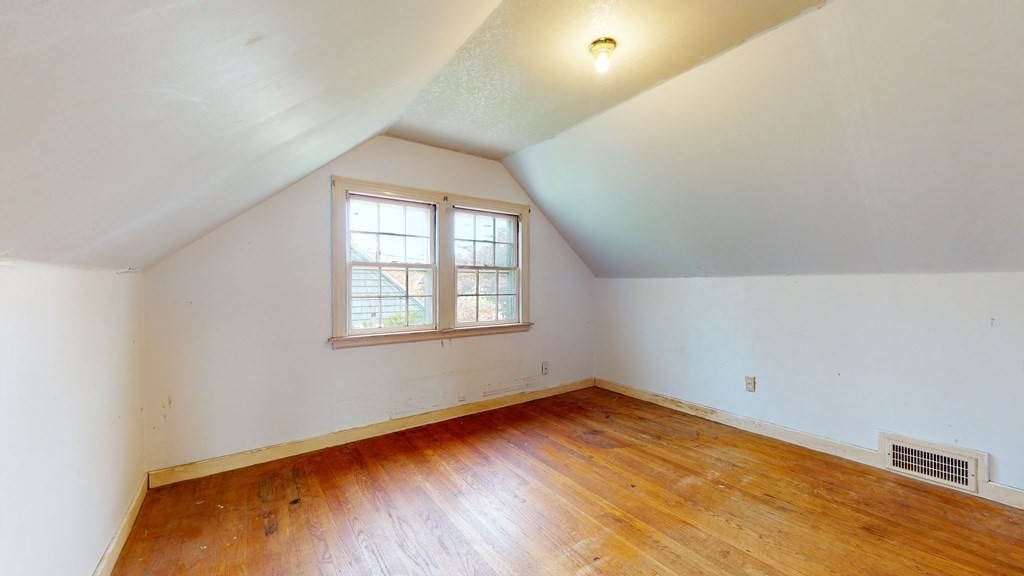 314 Burncoat Street Worcester, MA 01606 - Photo 19 of 29 an empty room with wooden floor and windows