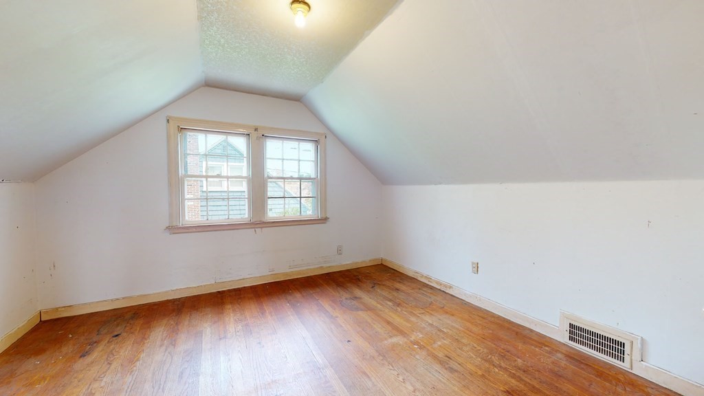 314 Burncoat Street Worcester, MA 01606 - Photo 20 of 29 an empty room with wooden floor and windows