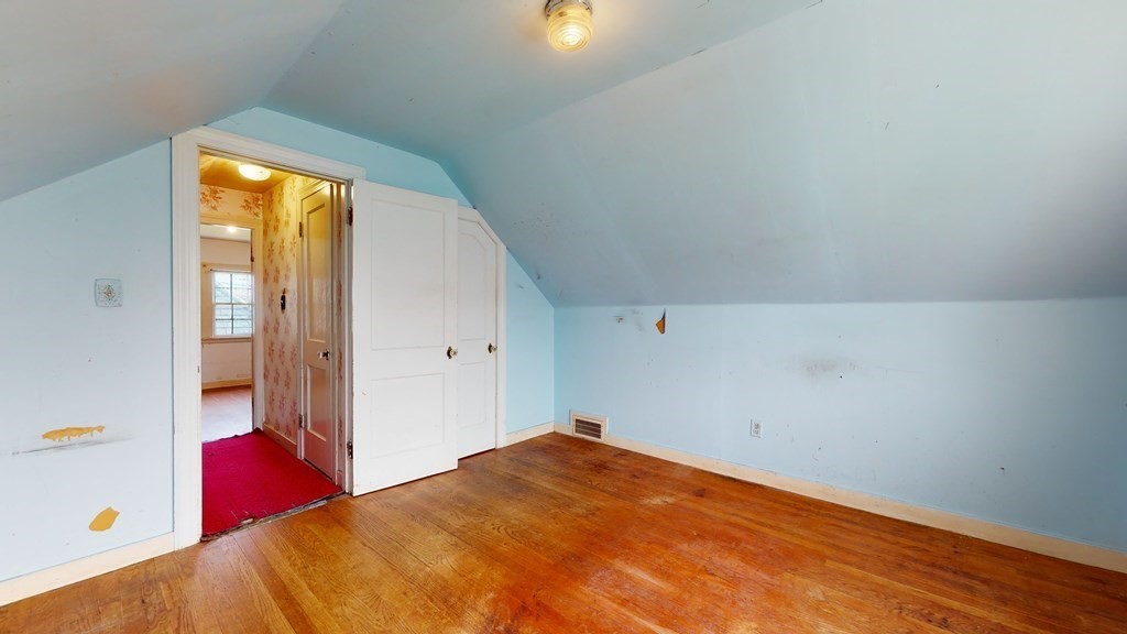 314 Burncoat Street Worcester, MA 01606 - Photo 24 of 29 a bedroom with a bed and a window