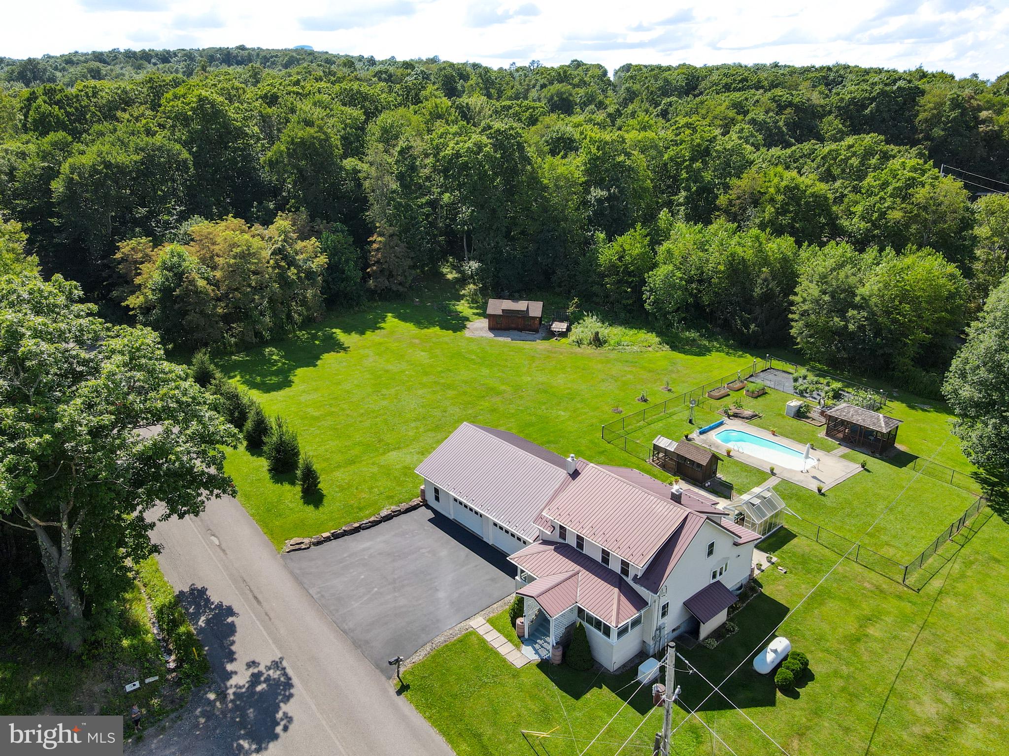 265 Fearer Road Friendsville, MD 21531 - Photo 2 of 75 Serene retreat with lush greenery.