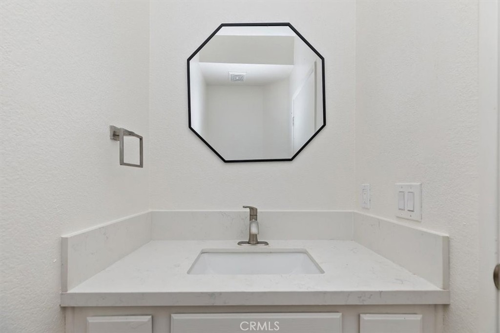 19912 Westerly Drive Riverside, CA 92508 - Photo 12 of 22 a bathroom with a sink and mirror