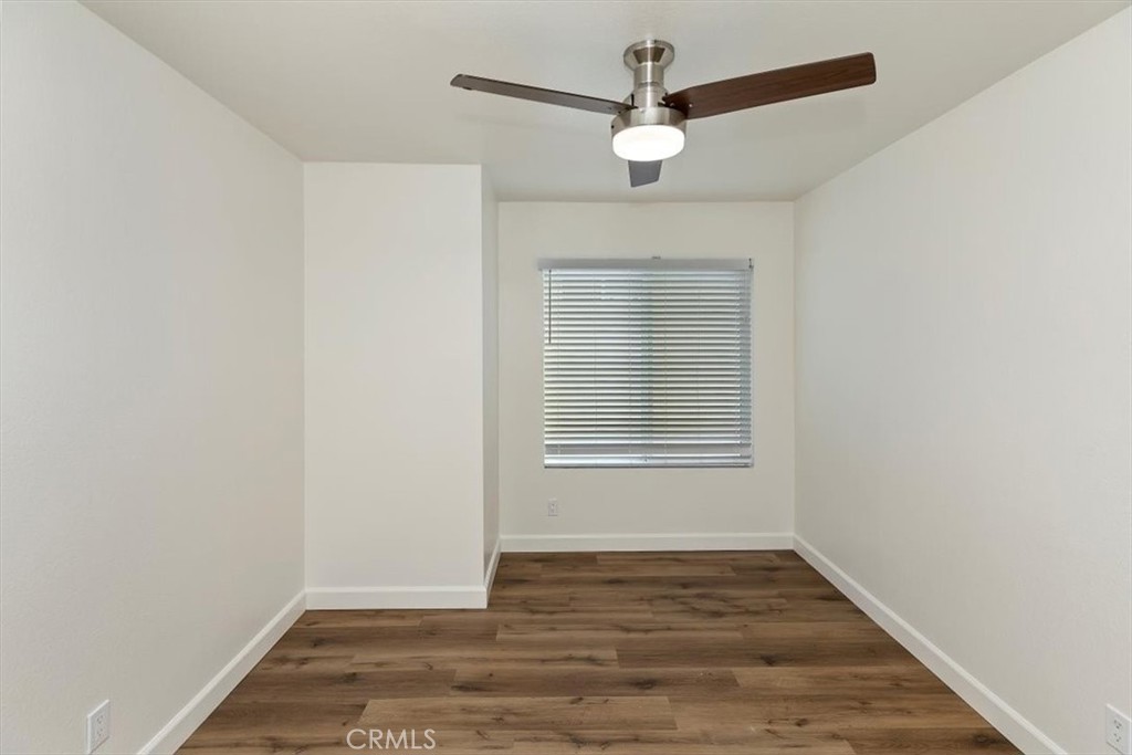 19912 Westerly Drive Riverside, CA 92508 - Photo 15 of 22 an empty room with wooden floor fan and window