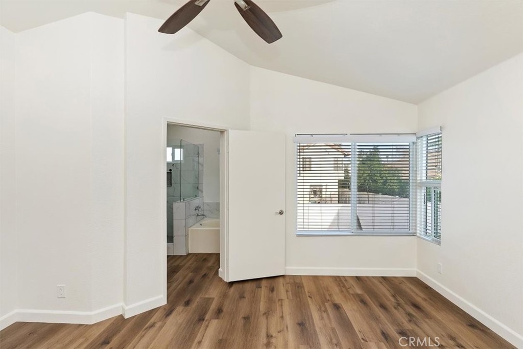 19912 Westerly Drive Riverside, CA 92508 - Photo 18 of 22 an empty room with wooden floor and windows