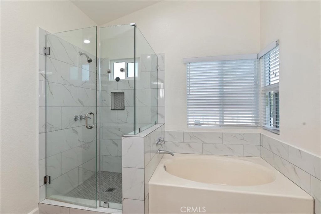 19912 Westerly Drive Riverside, CA 92508 - Photo 20 of 22 a bathroom with a bathtub and a shower