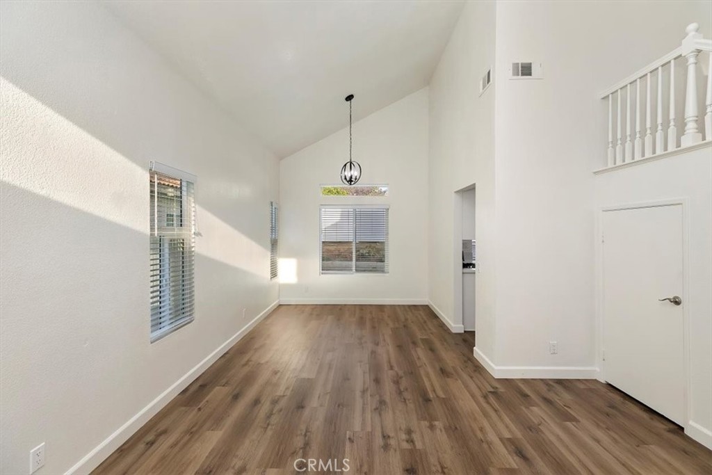 19912 Westerly Drive Riverside, CA 92508 - Photo 7 of 22 a view of a hallway with wooden floor and staircase