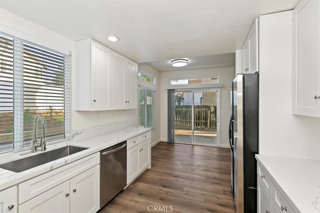 19912 Westerly Drive Riverside, CA 92508 - Photo 9 of 22 a kitchen with stainless steel appliances granite countertop a refrigerator and a sink