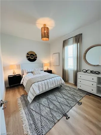 a bedroom with a bed and a dresser