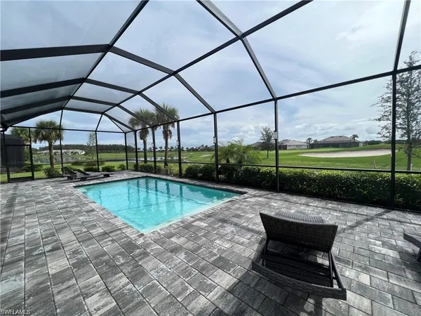 a view of a swimming pool with a porch