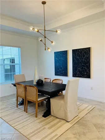 a living room with a table and chairs