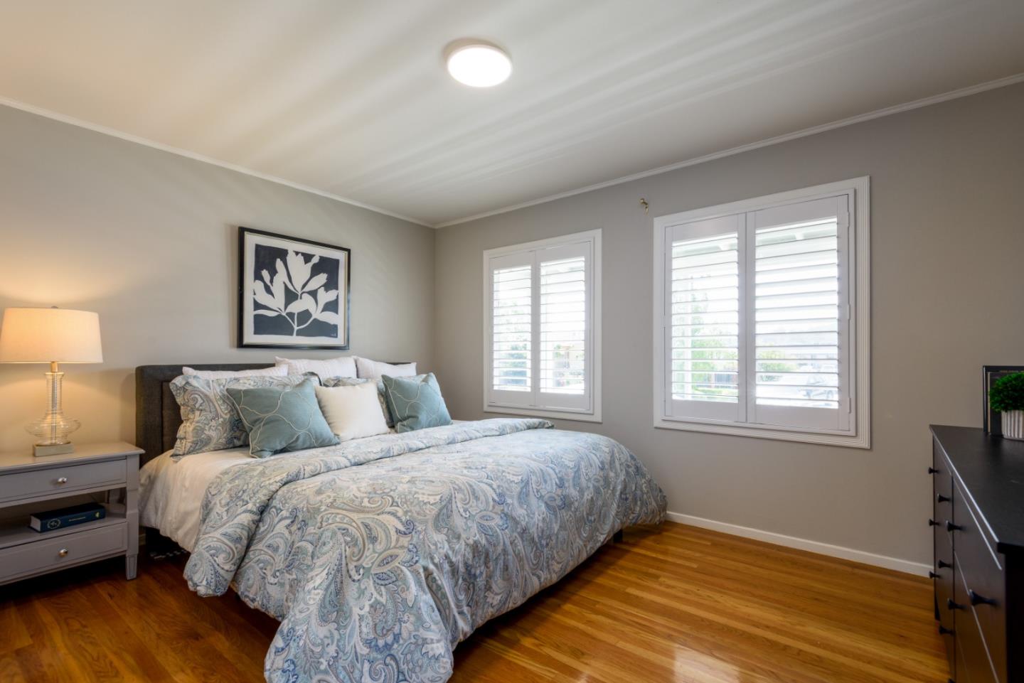 11 Meadow Court San Mateo, CA 94403 - Photo 12 of 31 a bedroom with a bed and wooden floor