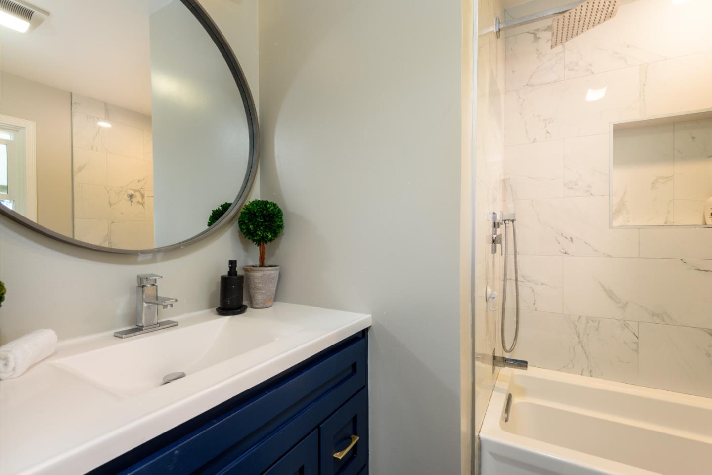 11 Meadow Court San Mateo, CA 94403 - Photo 14 of 31 a bathroom with a sink and a mirror