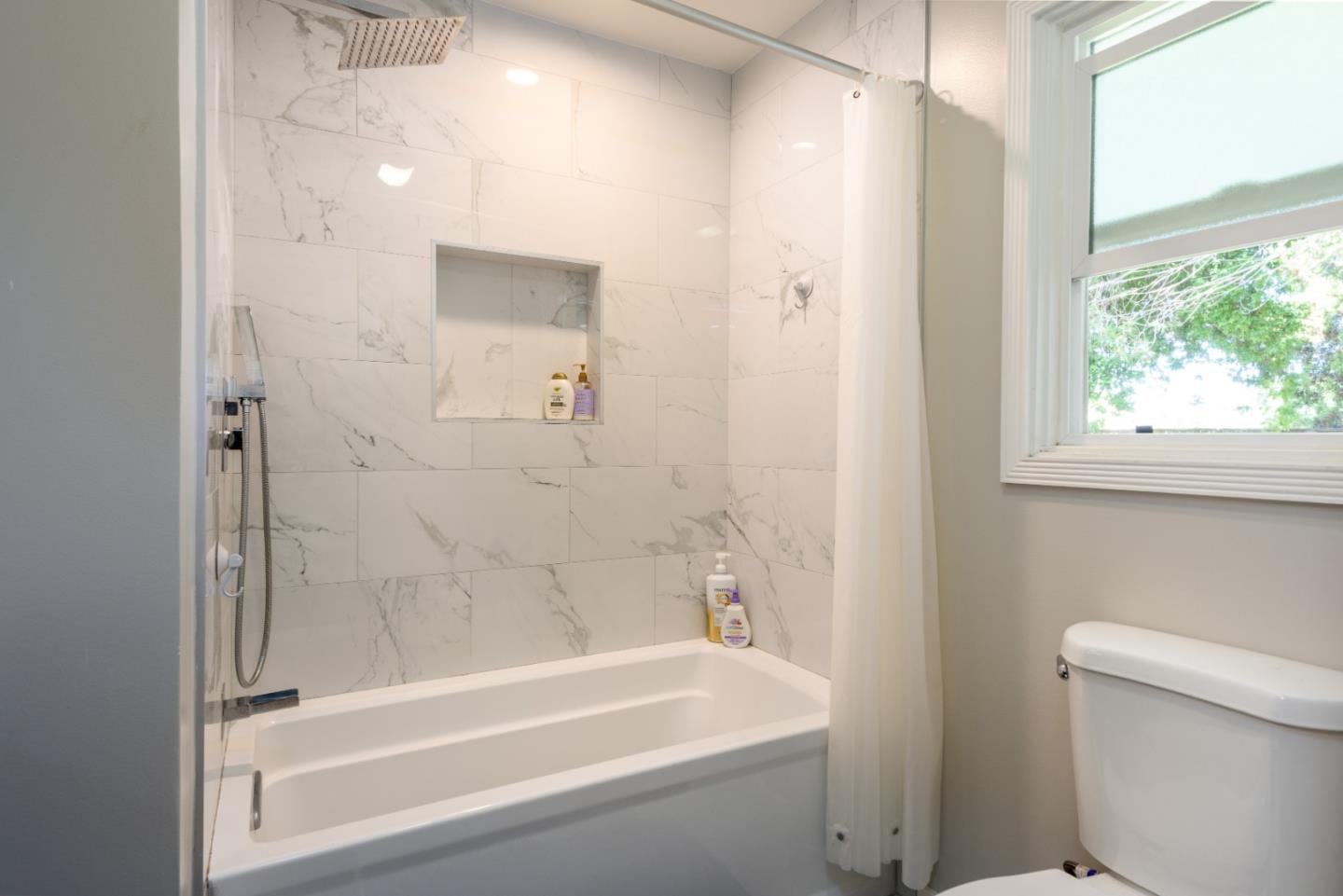 11 Meadow Court San Mateo, CA 94403 - Photo 15 of 31 a bathroom with a bathtub and a toilet