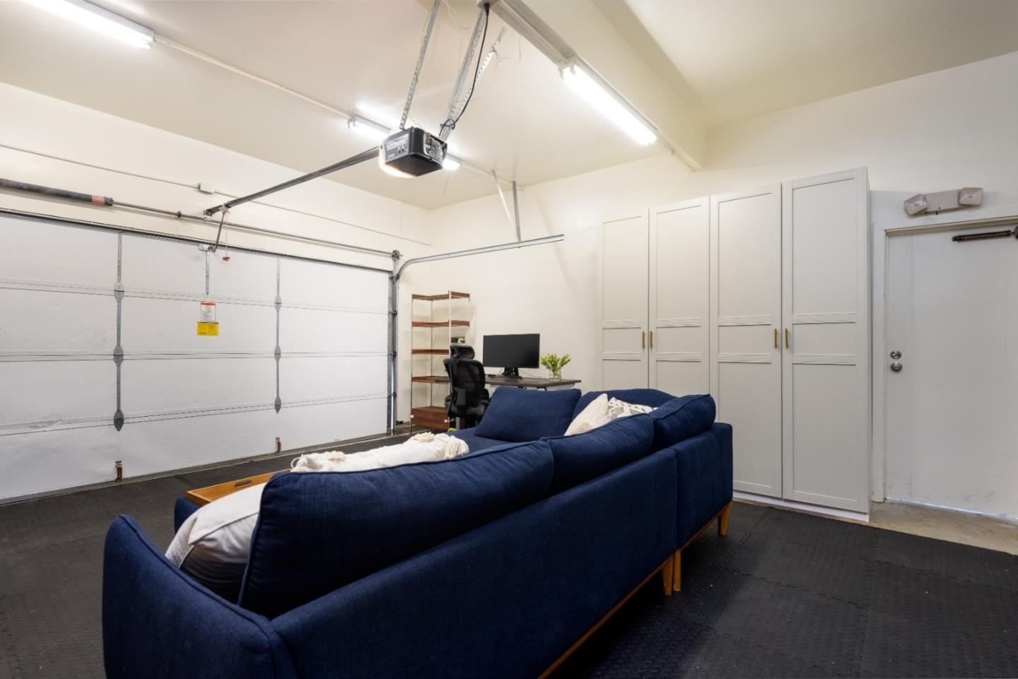 11 Meadow Court San Mateo, CA 94403 - Photo 22 of 31 a living room with couch and a ceiling fan