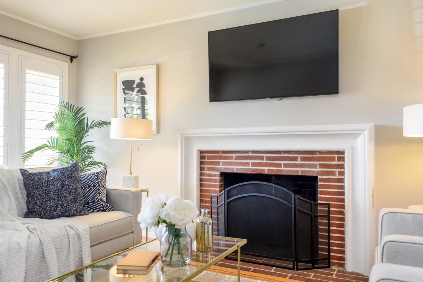 11 Meadow Court San Mateo, CA 94403 - Photo 5 of 31 a living room with a flat screen tv and a fireplace