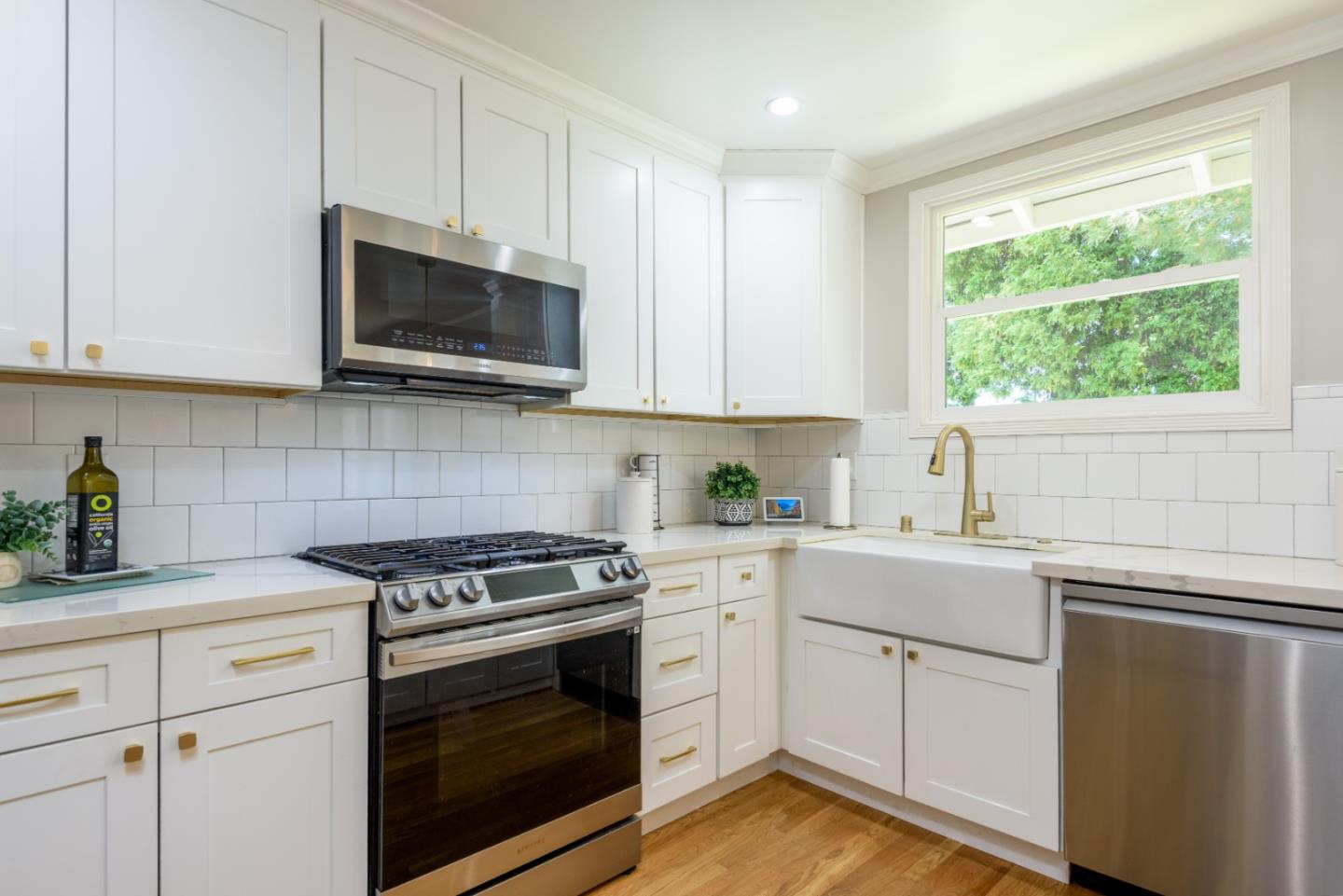 11 Meadow Court San Mateo, CA 94403 - Photo 9 of 31 a kitchen with white cabinets appliances and a window