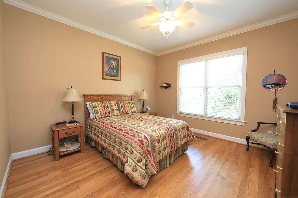 5800 Valley Mist Court Raleigh, NC 27613 - Photo 24 of 30 Hardwood floor, ceiling fan, crown molding Guest Bedroom