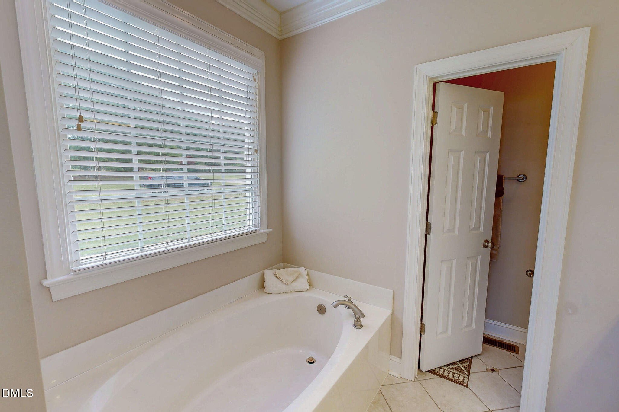 115 Duncan Plantation Road Timberlake, NC 27583 - Photo 16 of 48 a bathroom with a bathtub and a shower