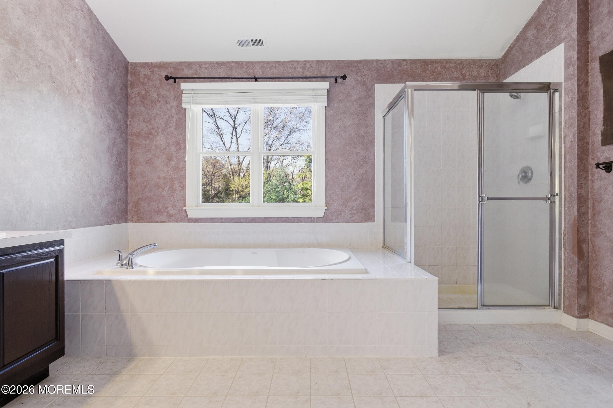 2 Mehar Court Jackson, NJ 08527 - Photo 16 of 47 a bathroom with a sink a bathtub and a window