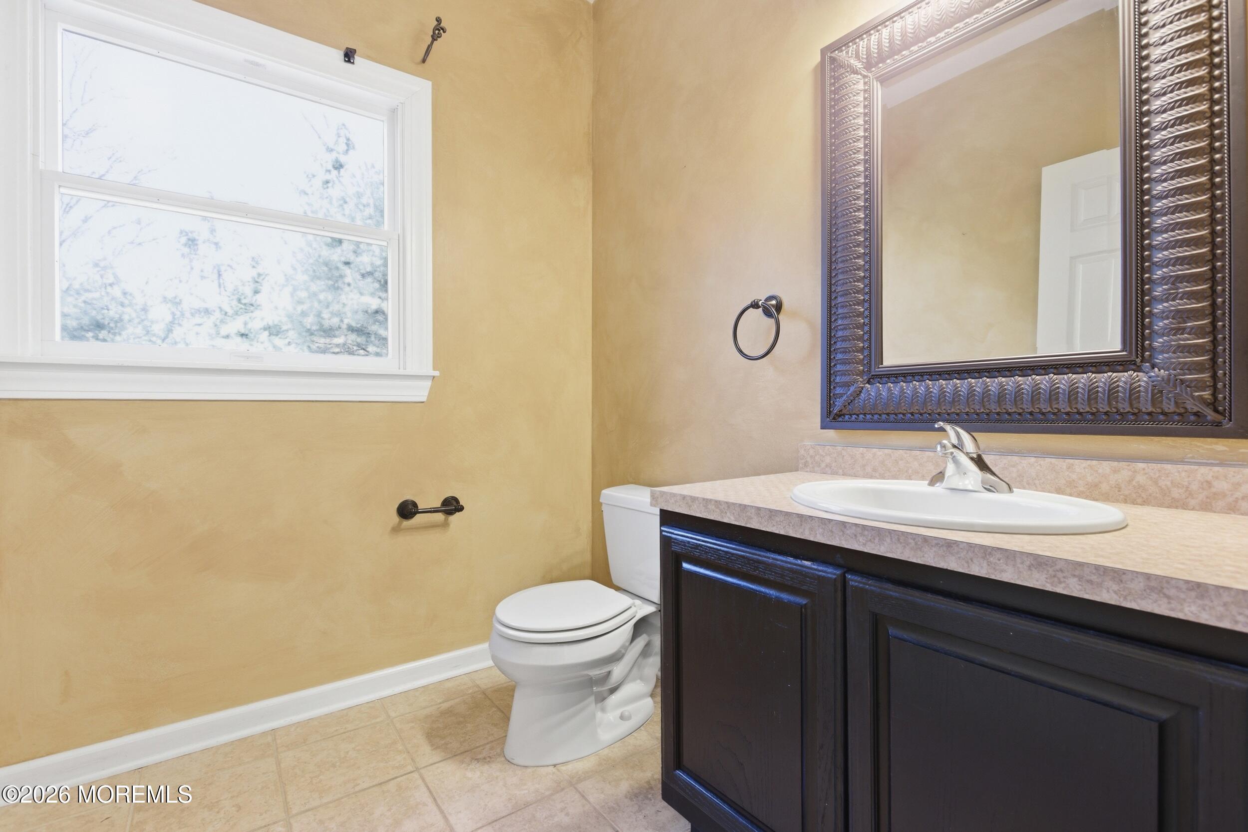 2 Mehar Court Jackson, NJ 08527 - Photo 18 of 47 a bathroom with a granite countertop toilet a sink and mirror