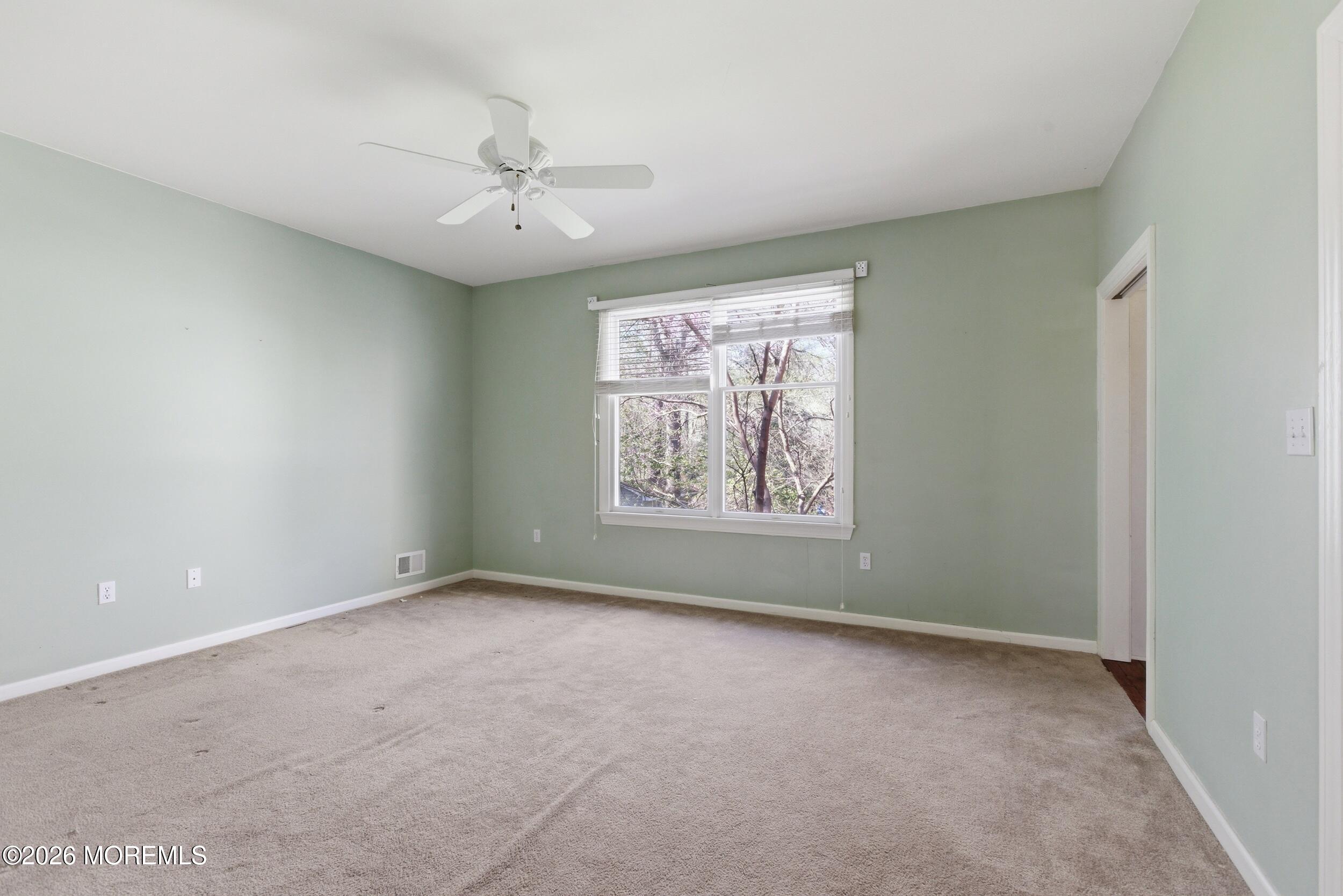 2 Mehar Court Jackson, NJ 08527 - Photo 21 of 47 an empty room with a window and ceiling fan