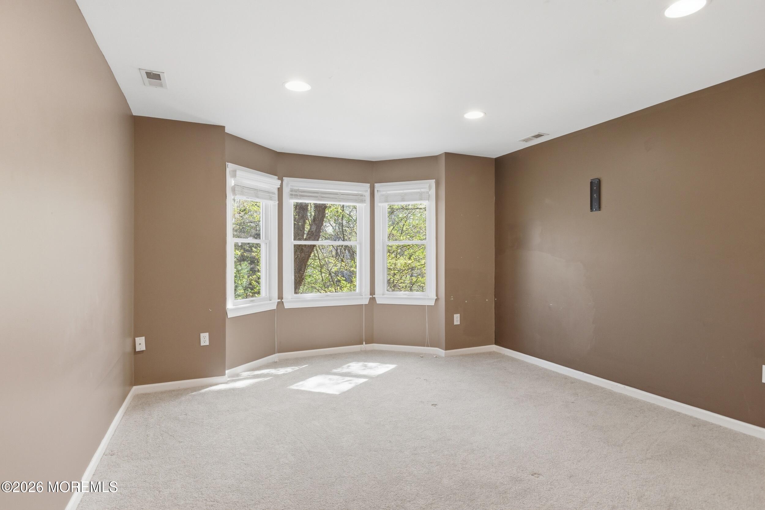 2 Mehar Court Jackson, NJ 08527 - Photo 22 of 47 a view of a big room with windows and chandelier fan
