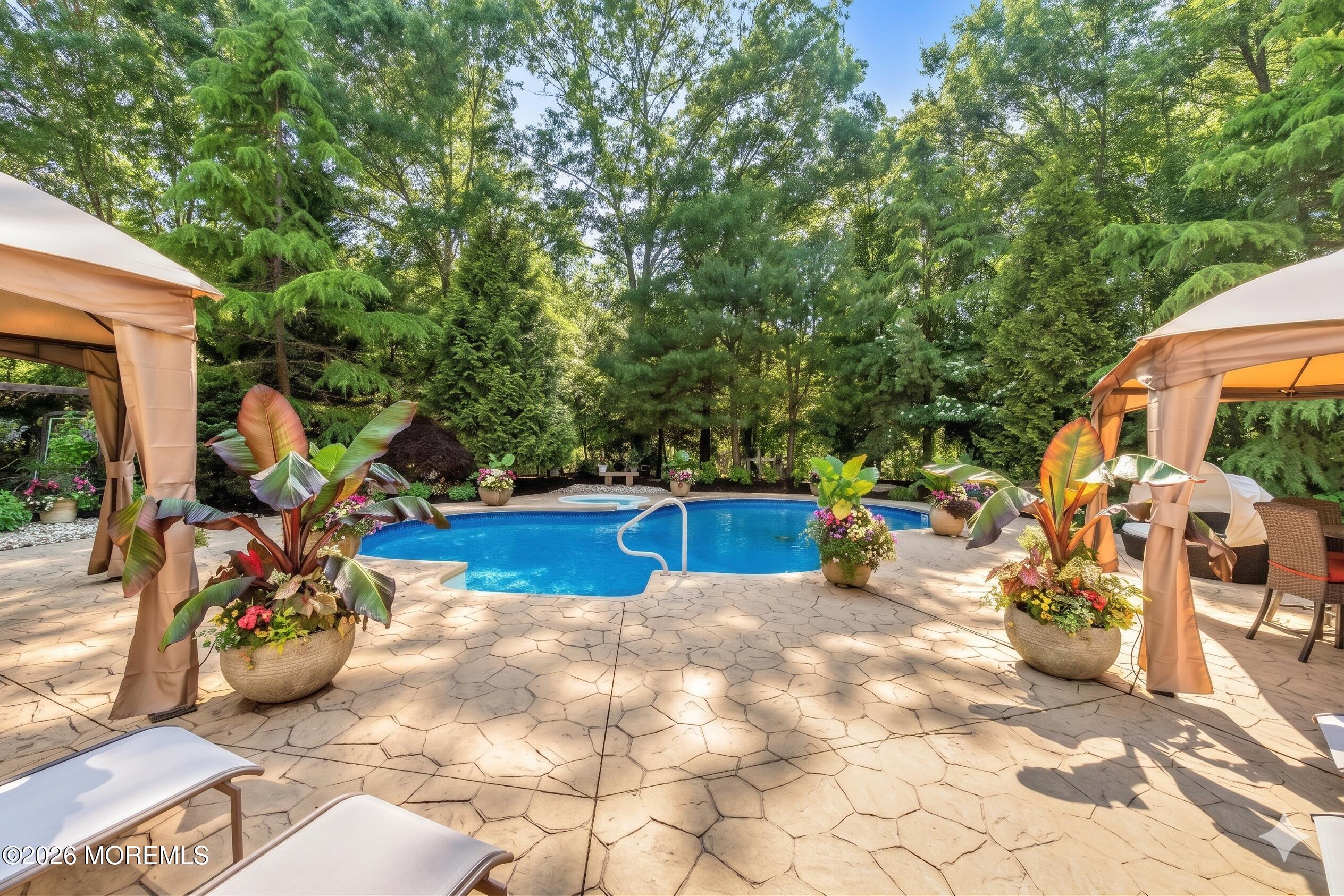 2 Mehar Court Jackson, NJ 08527 - Photo 42 of 47 a view of a patio with table and chairs potted plants with wooden floor and fence